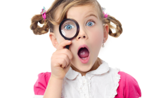 Girl with magnifying glass