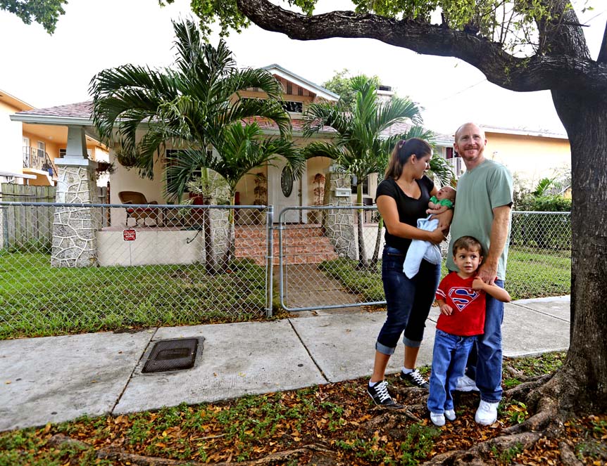 Milagro and Brice Ciener with Benjamin, 12, and Clark, 6 weeks, outside the Little Havana home they bought last year.