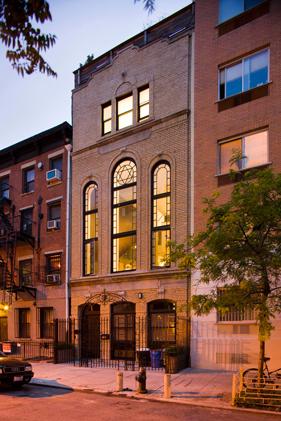 The facade at 317 East 8th Street, formerly a tenement-style shul