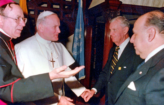Hugh Grant welcomes Pope John Paul II in the house in Oct. 1979.